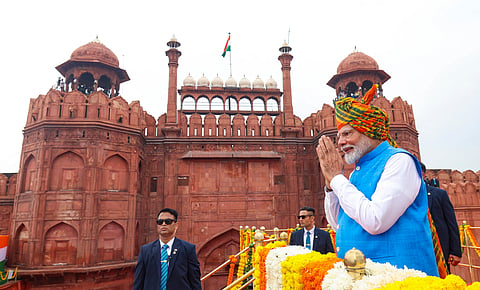Prime Minister Narendra Modi greets the gathering at the Red Fort on 78th Independence Day