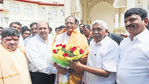 Prof M Kodandaram and Amer Ali Khan greet Legislative Council chairman Gutha Sukender Reddy after taking oath as the MLCs on Friday.