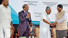 Chief Minister Pinarayi Vijayan greeting Supreme Court judge Justice B R Gavai at a function at the Kerala High Court on Friday