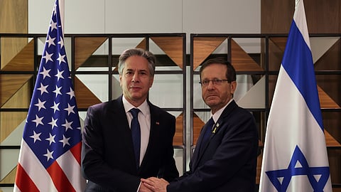 U.S. Secretary of State Antony Blinken, left, meets with Israel's President Isaac Herzog, in Tel Aviv, Israel.