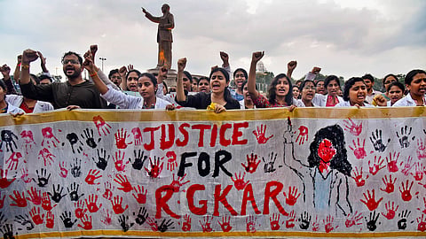 Doctors stage a protest demanding justice for a woman doctor who was allegedly raped and murdered at Kolkata's R G Kar Medical College and Hospital.