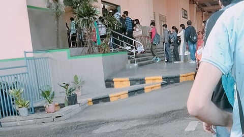The queue at Peenya Industry stretched up to the Tumakuru Main Road on Tuesday (Photo | Express)