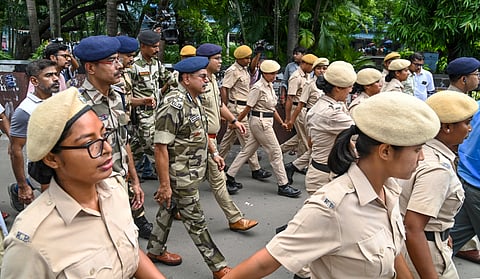 DIG CISF K Pratap Singh, centre, being escorted by women Kolkata police personnel inspects the R G Kar Medical College and Hospital for their deployment for security pupose in view of protests over recent rape and murder of a woman trainee doctor, in Kolkata, Wednesday, Aug. 21, 2024. 