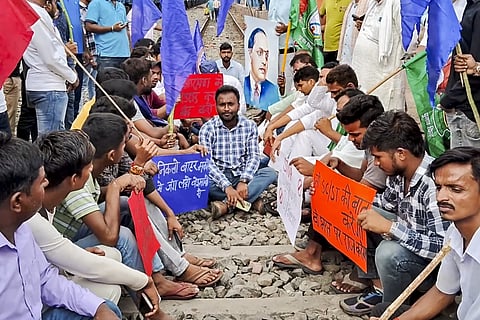 Bhim Army supporters block railway tracks in support of the Bharat Bandh call over the recent Supreme Court ruling on SC/ST reservations, in Arrah, Thursday, Aug. 21, 2024.