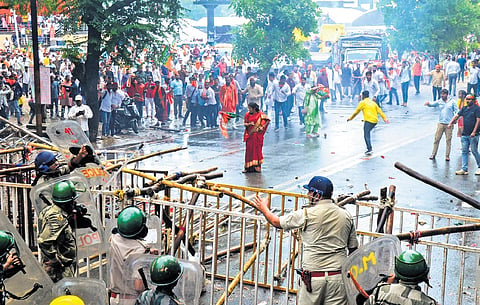Police personnel and BJYM men during Yuva Aakrosh Rally in Ranchi on Friday.