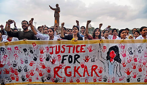 Doctors stage a protest demanding justice for a woman doctor who was allegedly raped and murdered at Kolkata's R G Kar Medical College and Hospital.