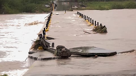 Ranjit Sagar Dam overflows as the water level reaches 29 feet after continuous heavy rainfall, on Thursday.