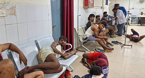Youths, who came for a recruitment rally, lie on the ground of a hospital while receiving treatment, in Palamu, Monday, Sept. 2, 2024. At least 12 youths died during the recruitment rally of Product Constable across Jharkhand State. 