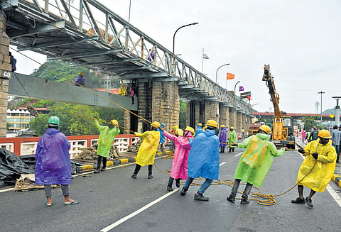 Repair works for the counterweight of gate 69 at Prakasam Barrage were underway in Vijayawada on Sunday.
