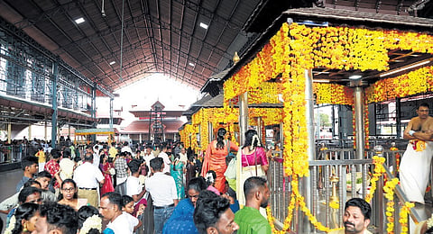 Wedding parties wait for their turn at Guruvayur temple on Sunday 