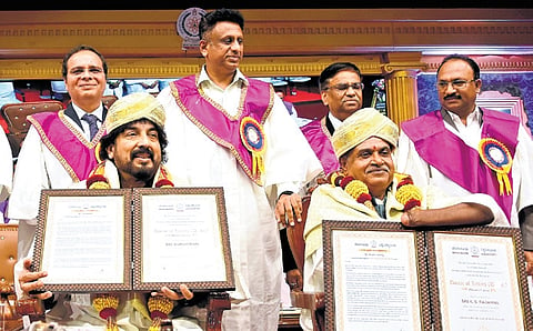 Music composer Gurukiran (seated, left) and former commissioner of Disability Rights Department, KS Rajanna, receive honorary doctorates from Higher Education Minister MC Sudhakar on Tuesday 