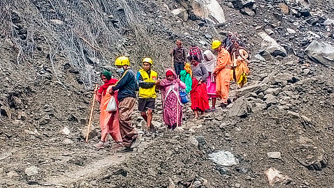 Stranded people being rescued after a landslide near Munkatiya between Sonprayag and Gaurikund on the Kedarnath National Highway on Monday evening, in Rudraprayag district, Tuesday, Sept 10, 2024. 