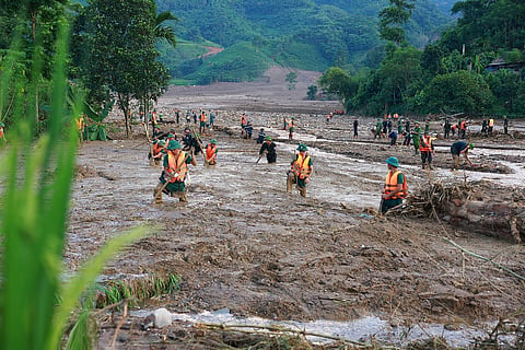 Rescue workers search for the missing after a flash flood buries a hamlet in mud and debris in the aftermath of Typhoon Yagi in Lao Cai province, Vietnam Thursday, Sept. 12, 2024. 