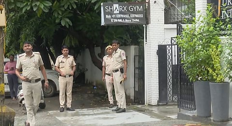 Police personnel during investigation after a gym owner was shot dead by two bike borne assailants, in Greater Kailash area of New Delhi, Friday, Sept. 13, 2024.