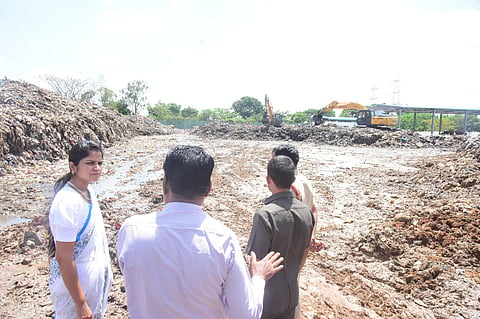 District Collector Valluru Kranthi inspecting the dump yard on the outskirts of Fasalwadi village near Sangareddy on Thursday.