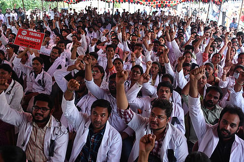 Members of AP PHCs doctors association stages protest demanding to revoke GO no 85 at Dharna Chowk in Vijayawada on Tuesday.