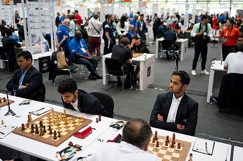 Vidit Gujrathi, center left, and Arjun Erigaisi, right, both of India, focus during their games at the 45th Chess Olympiad in Budapest, Hungary, Wednesday, Sept 11, 2024.