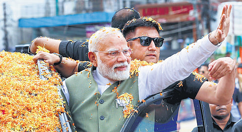 PM Narendra Modi in a roadshow for J&K Assembly elections in Reasi on Thursday.