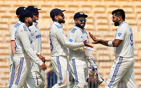 India's Jasprit Bumrah celebrates with teammates after taking the wicket of Bangladesh's Hasan Mahmud on the second day of the first test cricket match between India and Bangladesh, at the MA Chidambaram Stadium, in Chennai,