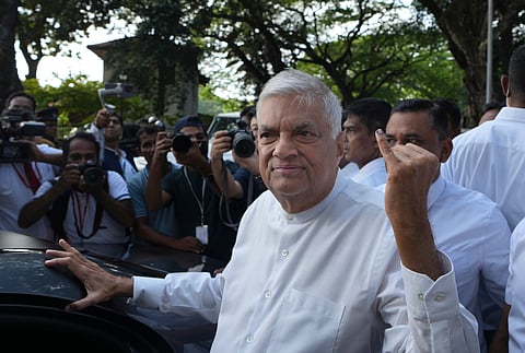 Sri Lankan president and independent presidential candidate Ranil Wickremesinghe shows indelible mark on his baby finger after casting his vote, in Colombo, Sri Lanka, Saturday, Sept. 21, 2024. 