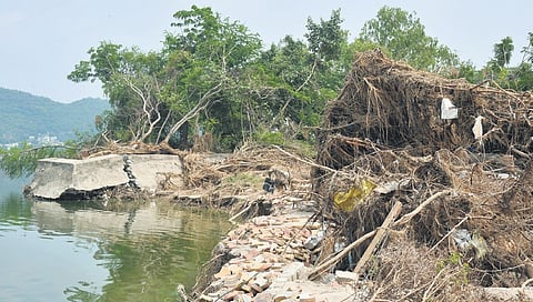 Caved footpaths on Bhavani Island in Vijayawada after floods 