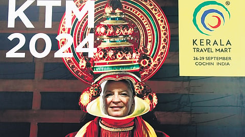 A foreigner tries out the selfie spot at the ongoing KTM 2024 at Samudrika Convention Centre on Friday.
