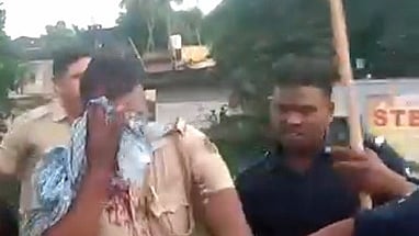 Video grab of a policeman injured during stone pelting in Bhadrak