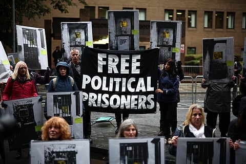 Supporters of the two Just Stop Oil environmental protesters, Phoebe Plummer and Anna Holland, gather with placards outside Southwark Crown Court in London on September 27, during their sentencing (Photo | AFP)