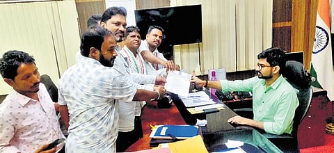 Members of Dist SC/ST Sangha presenting the letter to the collector 