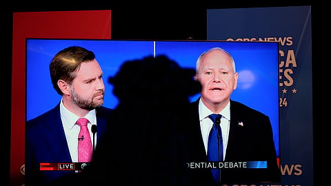 Viewers in the spin room watch the CBS News vice presidential debate, Tuesday, Oct. 1, 2024
