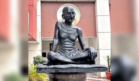 Gandhi statue outside the PUC Bank