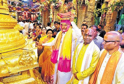 Chief Minister N Chandrababu Naidu and their wife Bhuvaneswari offer Pattu Vastrams to Lord Venkateswara Swamy; Priests perform Dwajarohanam at the Srivari temple in Tirumala on Friday 