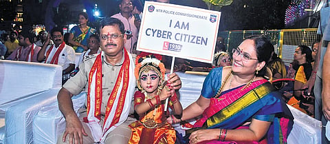 NTR district CP SV Rajashekhar Babu promoting cyber citizen mobile applications during Dasara festivities 