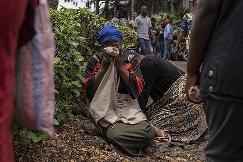 Women grieve at the port of Goma, Democratic Republic of Congo, after  a ferry carrying hundreds capsized on arrival, Thursday, Oct 3, 2024.