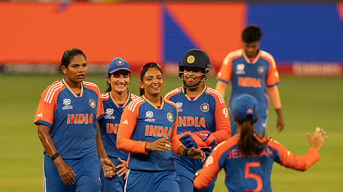 Indian team members celebrate after a wicket agaisnt New Zealand during the ICC Women's T20 World Cup