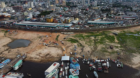The earth is exposed along the Negro River at the port in Manaus, Amazonas state, Brazil, Friday, Oct. 4, 2024, amid severe drought.