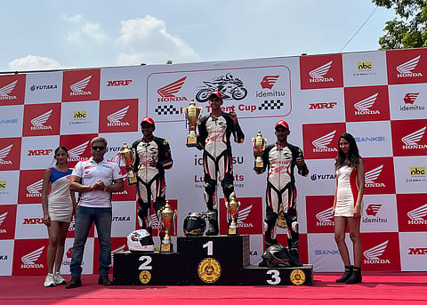 Mohsin Paramban (2), Savion Sabu (1) and Beedani Rajender (3) after Race 2 of the fifth and final round of the Honda India Talent Cup NSF250R in Chennai on Sunday