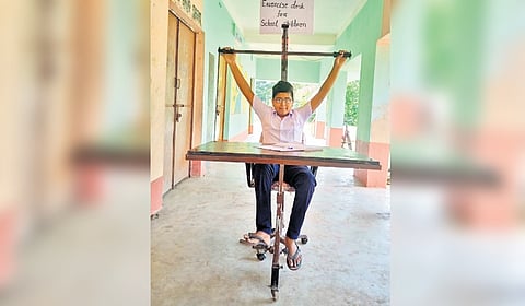 Soumya Ranjan Sahoo giving a demo of the exercise desk at his school in Jagatsinghpur.