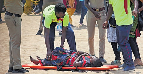 A woman being carried on a stretcher from the Marina on Sunday 