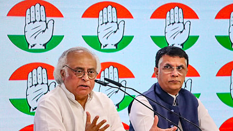 Congress leaders Jairam Ramesh and Pawan Khera address a press conference at AICC headquarters, in New Delhi, Tuesday, Oct. 8, 2024. 