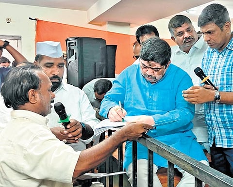 Transport Minister Ponnam Prabhakar listens to grievances of an applicant 
at the Gandhi Bhavan in Hyderabad