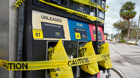Gas pumps are covered at a station ahead of arrival of Hurricane Milton. 