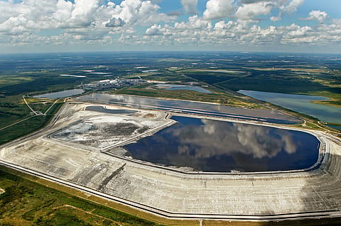  A sinkhole that opened up underneath a gypsum stack at a Mosaic phosphate fertilizer plant is seen in Mulberry, Fla., on Sept. 16, 2016