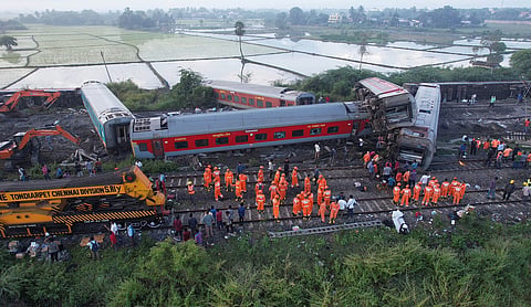 Indian railway workers and TNDRF restoring a train accident site.