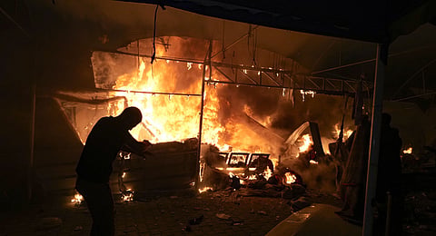 Israeli strike hit a tent area in the courtyard of Al Aqsa Martyrs hospital in Deir al Balah, Gaza Strip, Monday, Oct. 14, 2024. 
