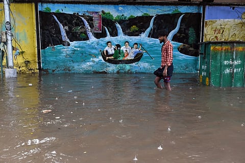 Normal life was brought to a standstill as heavy rains lashed Chennai on Tuesday. 