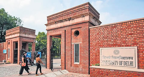DU whitewashing defaced walls as per court order
