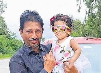 Chennappa Gowda with his grand daughter 