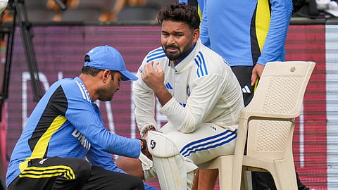 Indias wicket-keeper Rishabh Pant reacts after being taken off field following an injury on the second day of the first test cricket match between India and New Zealand, at the M Chinnaswamy Stadium, in Bengaluru, Thursday, Oct. 17, 2024.