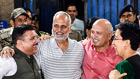 Delhi Chief Minister Atishi, along with Aam Aadmi Party (AAP) leaders Manish Sisodia and Sanjay Singh, welcome party leader Satyendar Jain on his release from Tihar jail in New Delhi on Friday, Oct.18, 2024